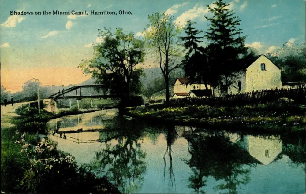 Postcard of tree shadows falling across the Miami canal