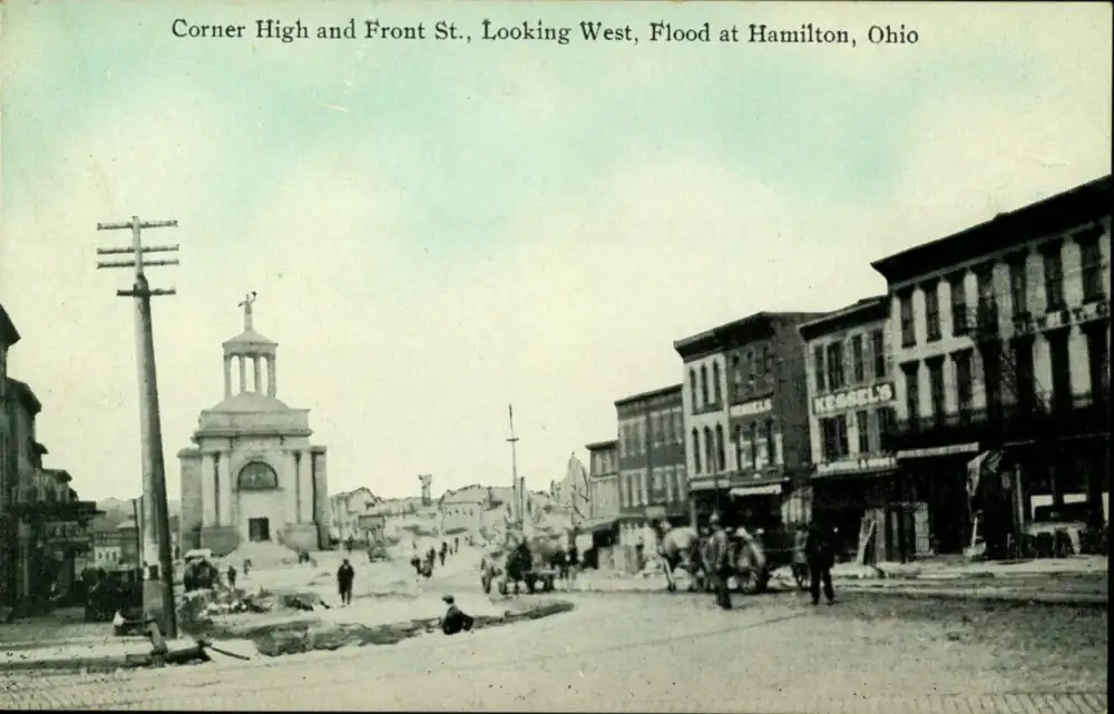Postcard of the corner of High and Front Streets showing flood damage