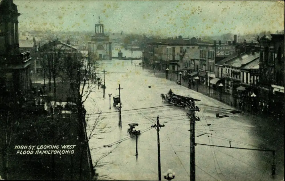 Postcard of High Street looking west showing flood damage